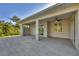 A wide-open covered patio with tiled flooring creates an inviting outdoor space at 3694 Crittendon St, North Port, FL 34286