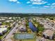 An aerial view showcasing community buildings, lakes, and lush landscaping at 3718 59Th Ave W # 3718, Bradenton, FL 34210