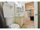 Bathroom with updated vanity sink and toilet leading into the bedroom at 3718 59Th Ave W # 3718, Bradenton, FL 34210