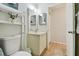 Bright bathroom features a vanity, storage, and wood look flooring at 3718 59Th Ave W # 3718, Bradenton, FL 34210