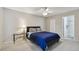 Bedroom features neutral paint, ceiling fan and ensuite bath at 3718 59Th Ave W # 3718, Bradenton, FL 34210