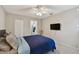 Bedroom with ceiling fan features neutral paint and ensuite bath at 3718 59Th Ave W # 3718, Bradenton, FL 34210