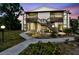 Two-story condo with stairs, wooden accents, and lawn at dusk at 3718 59Th Ave W # 3718, Bradenton, FL 34210