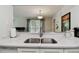 Bright kitchen with quartz countertops and stainless steel sink with modern faucet fixtures at 3718 59Th Ave W # 3718, Bradenton, FL 34210