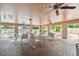 Breezy recreation room with tables and chairs with a view of the pool at 3718 59Th Ave W # 3718, Bradenton, FL 34210