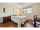 Comfortable bedroom with hardwood floors, neutral colors, and a window that lets in plenty of natural light at 3859 Catalina Dr, Bradenton, FL 34210