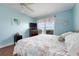 Bright bedroom with hardwood floors, a large window overlooking the water, and comfortable bed at 3859 Catalina Dr, Bradenton, FL 34210