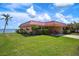 Charming condo with green lawn and exterior view showcasing convenient parking and easy access to the waterfront at 3859 Catalina Dr, Bradenton, FL 34210