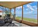 Screened patio featuring seating area and stunning views of the bay for year-round outdoor enjoyment at 3859 Catalina Dr, Bradenton, FL 34210