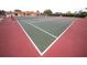 Community tennis courts featuring red and green surfaces at 3859 Catalina Dr, Bradenton, FL 34210