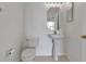 Half bathroom with toilet and pedestal sink at 4007 61St E Dr, Bradenton, FL 34203