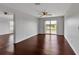 Bedroom featuring a ceiling fan and access to a balcony at 4007 61St E Dr, Bradenton, FL 34203