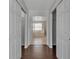 Hallway view to bathroom featuring tile flooring and white doors with closet access at 4007 61St E Dr, Bradenton, FL 34203