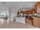 Kitchen featuring stainless steel appliances, wood cabinets, and granite countertops at 4007 61St E Dr, Bradenton, FL 34203