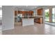 Kitchen featuring stainless steel appliances, wood cabinets, and granite countertops at 4007 61St E Dr, Bradenton, FL 34203