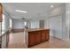 Bright kitchen featuring a wood island with granite countertops and tile flooring at 4007 61St E Dr, Bradenton, FL 34203