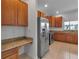 Kitchen featuring stainless steel appliances, wood cabinets, and granite countertops at 4007 61St E Dr, Bradenton, FL 34203