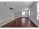 Open-concept living room with wood floors and tile entrance at 4007 61St E Dr, Bradenton, FL 34203