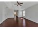 Spacious main bedroom with tray ceiling, ceiling fan, wood floors and ensuite bathroom access at 4007 61St E Dr, Bradenton, FL 34203