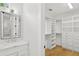 Bathroom with a walk-in closet, marble countertop, and tiled shower at 4013 Red Rock Ln, Sarasota, FL 34231