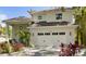 Beautiful two-story home featuring a white exterior, tiled roof, and a two-car garage at 4013 Red Rock Ln, Sarasota, FL 34231