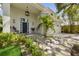 Charming home featuring a well-manicured lawn, lush landscaping, and inviting curb appeal at 4013 Red Rock Ln, Sarasota, FL 34231