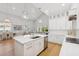 Open kitchen and living area with stainless steel appliances and bright natural light at 4013 Red Rock Ln, Sarasota, FL 34231
