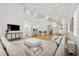 Spacious open-concept living area with high ceilings, large windows, and stylish decor at 4013 Red Rock Ln, Sarasota, FL 34231