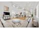 Spacious living room with vaulted ceilings, an open floor plan to the kitchen, and a staircase leading to the second floor at 4013 Red Rock Ln, Sarasota, FL 34231