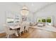 Bright living and dining area showcasing plantation shutters and a seamless indoor-outdoor transition at 4013 Red Rock Ln, Sarasota, FL 34231
