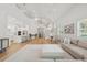 Inviting living space with a staircase, dining area, open to the kitchen, hardwood floors, and ample natural light at 4013 Red Rock Ln, Sarasota, FL 34231