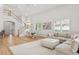 Cozy living room with a staircase and dining area, boasting lots of natural light and seamless flow to the entryway at 4013 Red Rock Ln, Sarasota, FL 34231