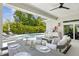 Inviting outdoor space with a fully equipped kitchen, dining table, and a view of the pool at 4013 Red Rock Ln, Sarasota, FL 34231
