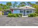 Charming single-story home with a well-maintained front yard and carport at 4019 Worcester Rd, Sarasota, FL 34231