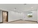 Bright bedroom with hardwood floors, neutral paint, and ensuite bathroom at 405 Sunset N Rd, Rotonda West, FL 33947