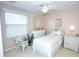 Bright and inviting bedroom features neutral walls, ceiling fan, and ample natural light from the window at 4069 Overture Cir # 341, Bradenton, FL 34209