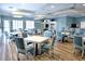 Community room with kitchen, tables, chairs, bar, TV, and lounge area at 4069 Overture Cir # 341, Bradenton, FL 34209
