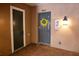 Exterior entrance featuring a door with a wreath and a fire extinguisher at 4069 Overture Cir # 341, Bradenton, FL 34209