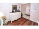 Inviting entryway features wood floors and decorative console table with framed artwork, creating a warm welcome at 4069 Overture Cir # 341, Bradenton, FL 34209