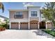 Charming townhome showcasing multiple garages, beautiful brick driveway and manicured landscaping at 4069 Overture Cir # 341, Bradenton, FL 34209