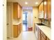 Bright kitchen with light wood cabinets and white countertops at 4069 Overture Cir # 341, Bradenton, FL 34209