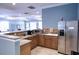 Community kitchen area with stainless steel refrigerator, sink, microwave and countertops at 4069 Overture Cir # 341, Bradenton, FL 34209