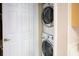 Laundry closet with a stacked washer and dryer at 4069 Overture Cir # 341, Bradenton, FL 34209
