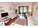 Bright living room with wood floors, comfortable seating, and sliding glass doors to the outside at 4069 Overture Cir # 341, Bradenton, FL 34209