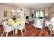 Bright living room with hardwood floors, multiple seating areas, natural light, and access to a screened lanai at 4069 Overture Cir # 341, Bradenton, FL 34209