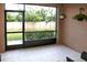 Enclosed patio with tile flooring and a view of the backyard at 4069 Overture Cir # 341, Bradenton, FL 34209