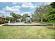 Community playground featuring modern play equipment, surrounded by trees and grassy area, ideal for children at 4069 Overture Cir # 341, Bradenton, FL 34209