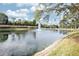 Pond with fountain, palm trees and blue skies as part of the community landscaping at 4069 Overture Cir # 341, Bradenton, FL 34209