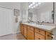 Inviting bathroom with double sinks, a large mirror and generous counter space at 4136 Cascade Falls Dr, Sarasota, FL 34243
