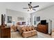 Cozy bedroom with neutral tones, a ceiling fan, and traditional furnishings at 4136 Cascade Falls Dr, Sarasota, FL 34243